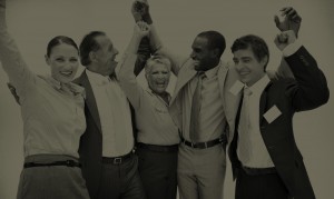 black and white photo of business team enjoying victory