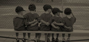 kids in a baseball team having each other's back