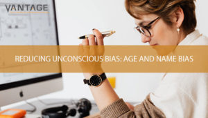 woman in front of her computer holding a pen with text reading reducing unconscious bias: age and name bias
