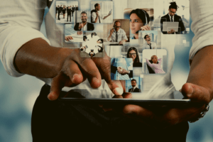 man holding tablet with people images showing
