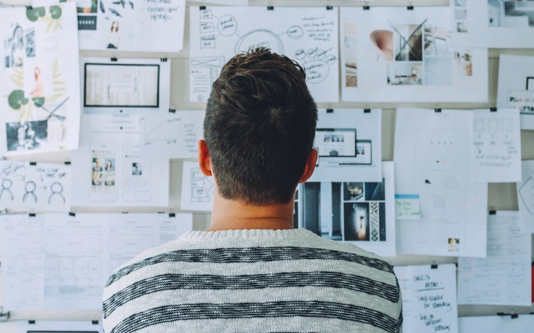 Man looking at wall of options.